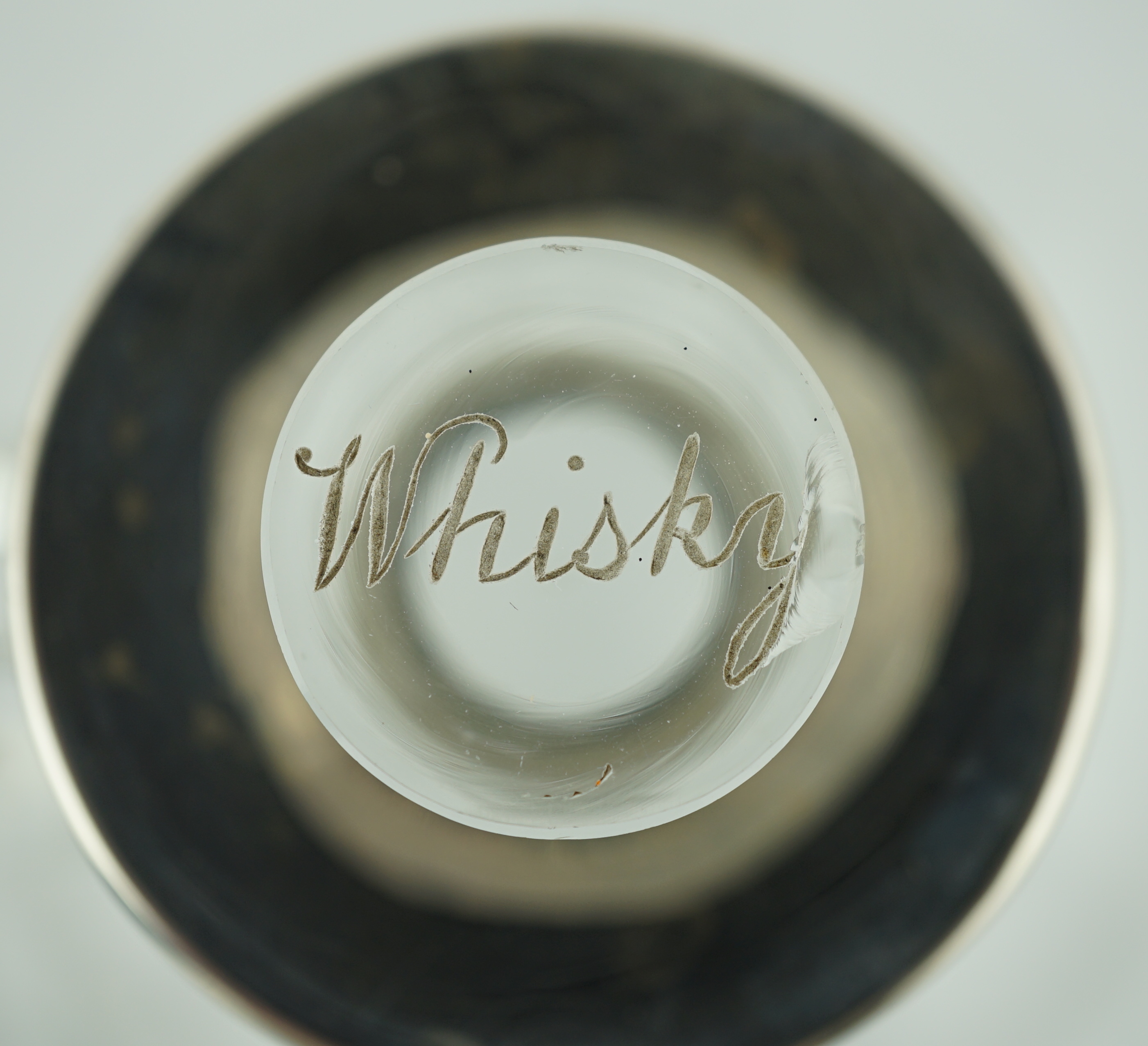 A pair of Edwardian silver mounted glass decanters, with stoppers etched 'Whisky' & 'Brandy', by Charles & George Asprey